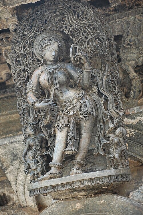 File:Belur Temple Apsara with Mirror.JPG