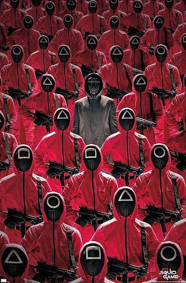 Rows of masked figures in red suits with black symbols stand armed, a central figure in gray. Eerie, tense mood. “Squid Game” text visible.