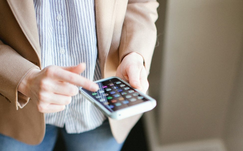person using smartphone inside room person using smartphone inside room