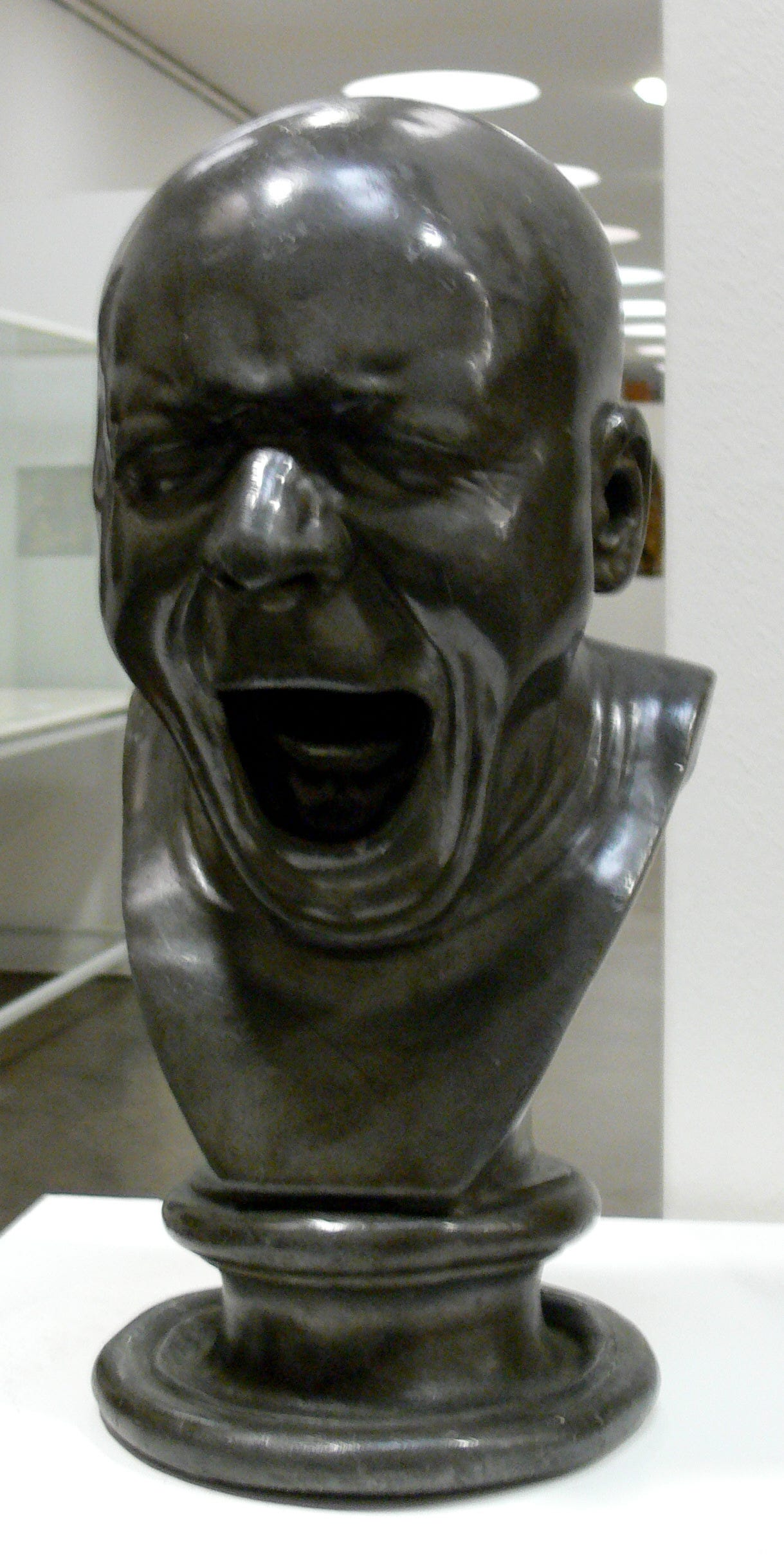 Grimacing sculpted head