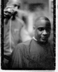 Omar Credle a.k.a. O.C. getting a haircut in 1997 