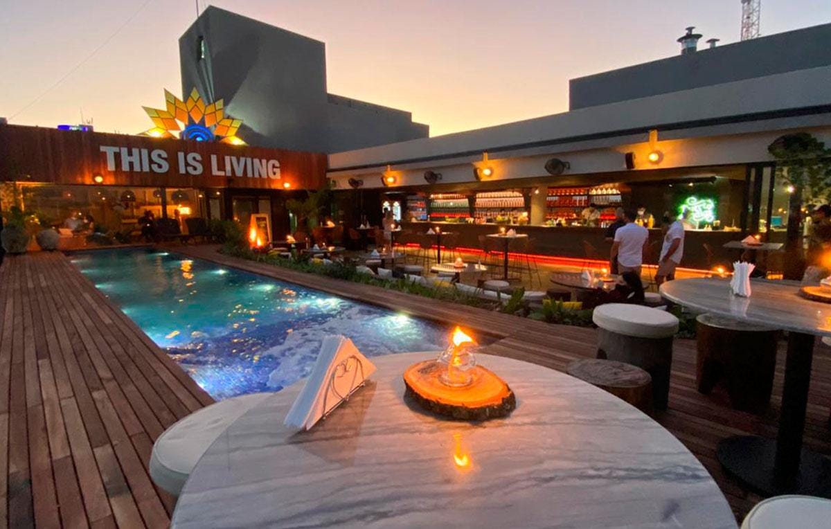 A picture containing sky, outdoor, orange, resort

Description automatically generated