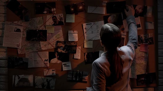 Smart Detective Looking Attentively At Investigation Board Evaluating ...
