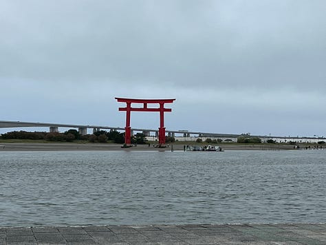 pictures of a torii gate and hotels near Bentenjima, Japan
