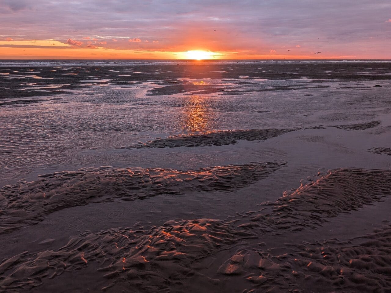 Sunset reflection on the sand