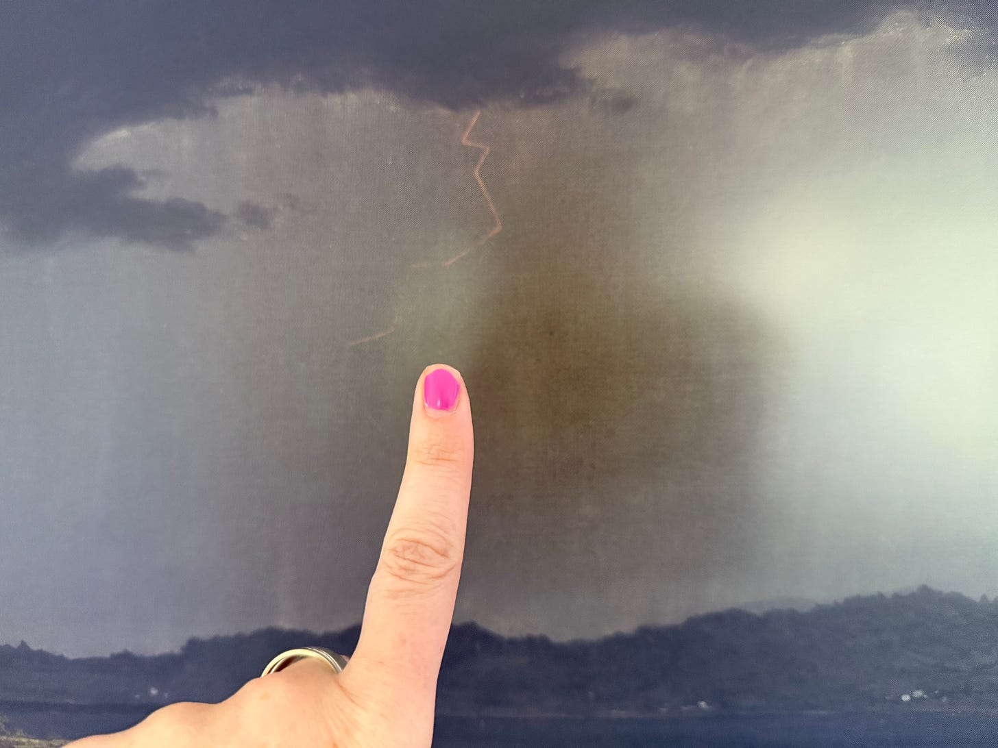 Megan Falley's finger, with its nail painted pink, excitingly points out a lightning bolt in the Martin Heade Johnson painting!
