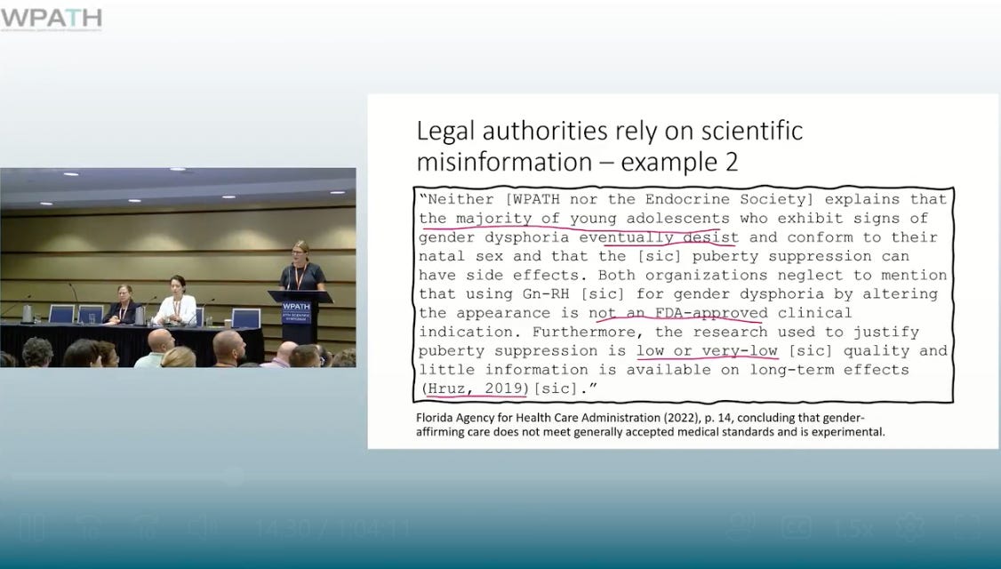 A person standing at a podium and a person standing at a podium
AI-generated content may be incorrect.