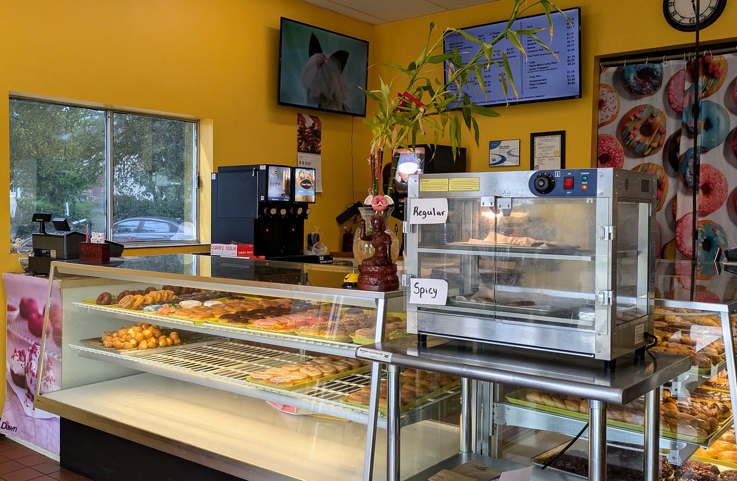 Interior of Linda Donuts, what you see when you first walk in: Wide donut display cases