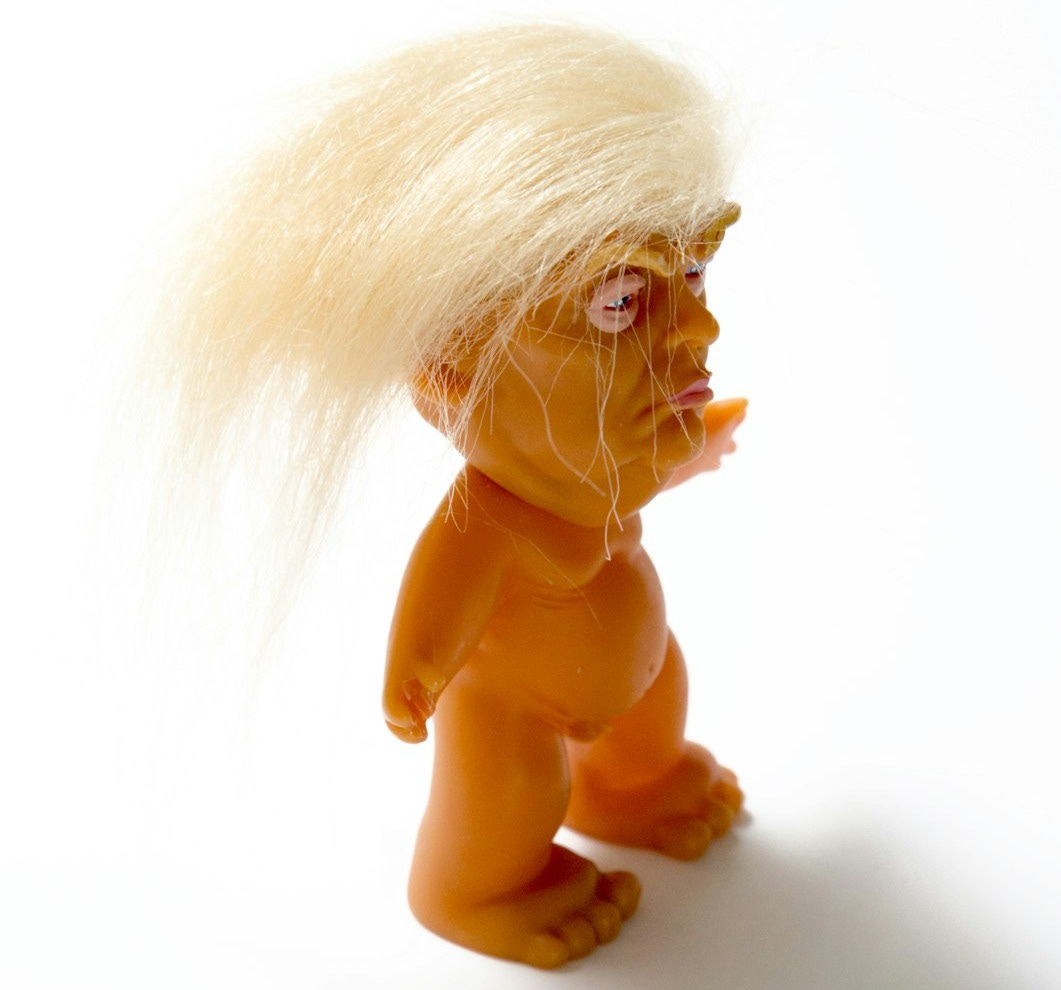 brown and white lion plastic toy