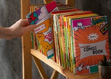 Comic books on a shelf.