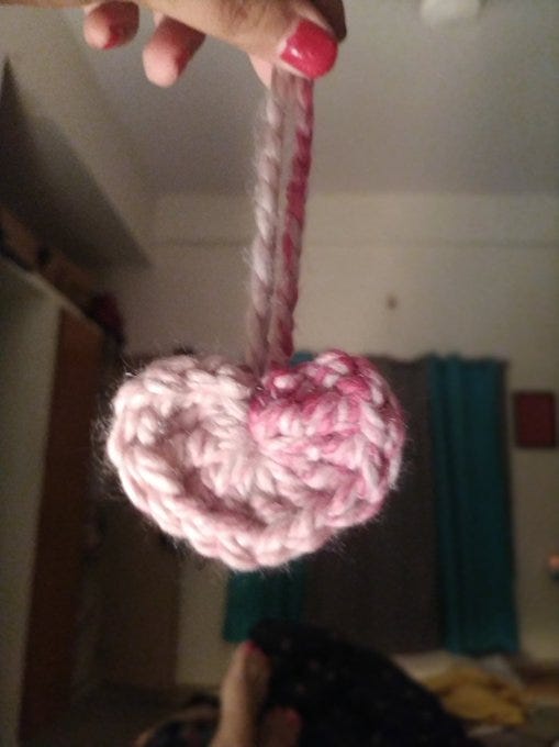 A heart shaped ornament done in crochet A heart shaped ornament done in crochet