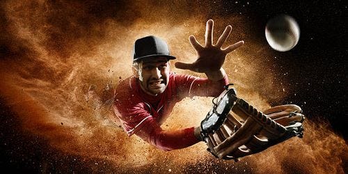 Outfielder Catching Baseball Outfielder baseball player about to catch ball during baseball game . catching baseball stock pictures, royalty-free photos & images