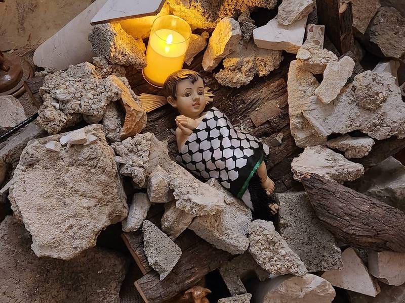 Baby Jesus lies amid rubble in Bethlehem church Christmas nativity scene