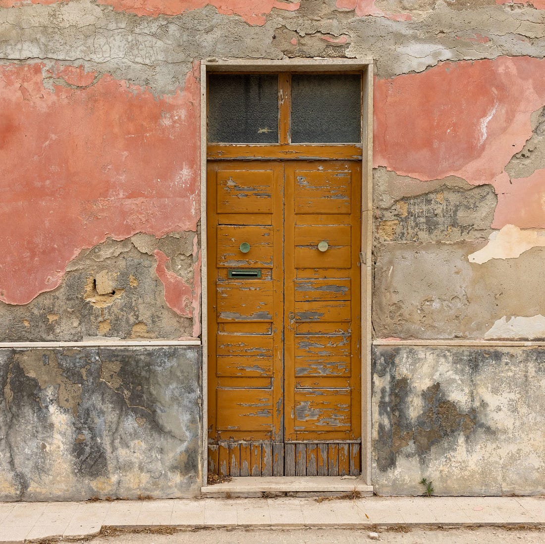 A weathered door in the back lanes of Marzamemi, Sicily. A weathered door in the back lanes of Marzamemi, Sicily.