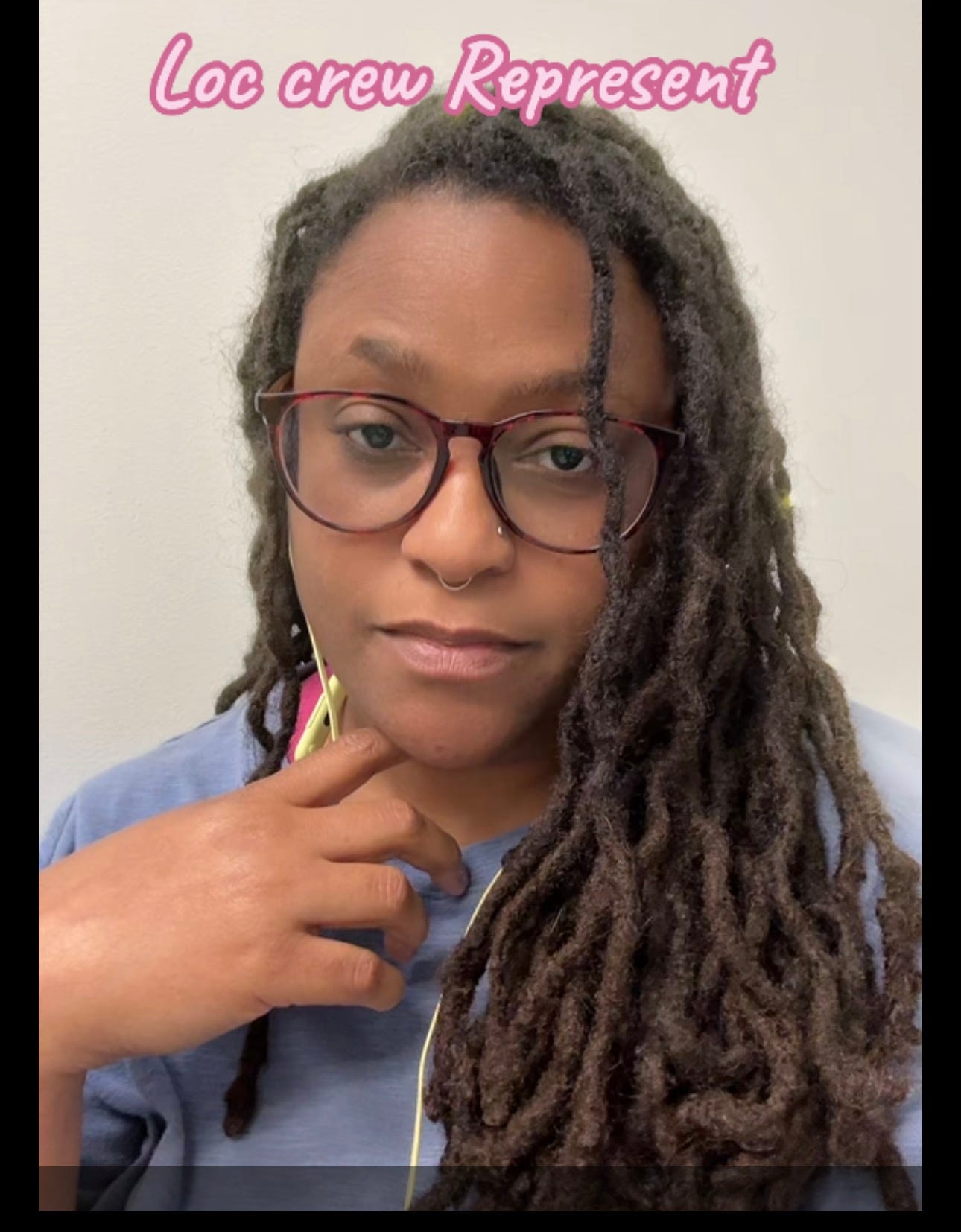 Jewels wearing glasses and a blue shirt, showing off her freshly retwisted locs, with the words ‘Loc crew represent’ above. Jewels wearing glasses and a blue shirt, showing off her freshly retwisted locs, with the words ‘Loc crew represent’ above.