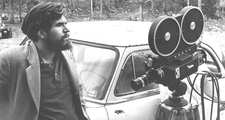 an image of Stan Brakhage with a film camera