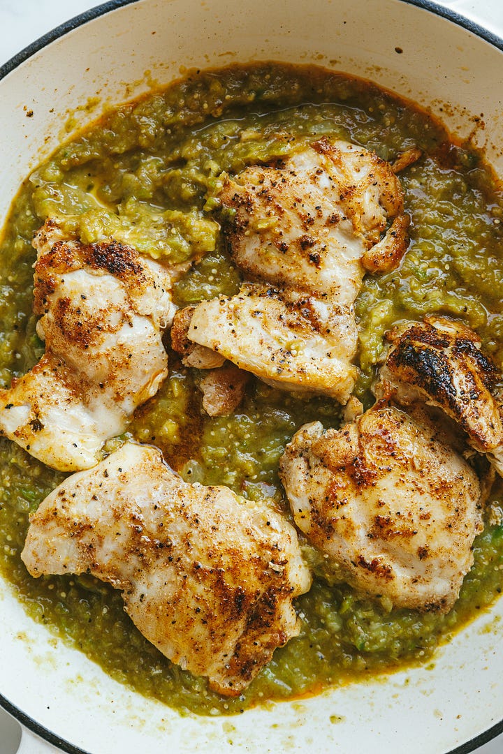 Tomatillo salsa with chicken cooking in the mixture.