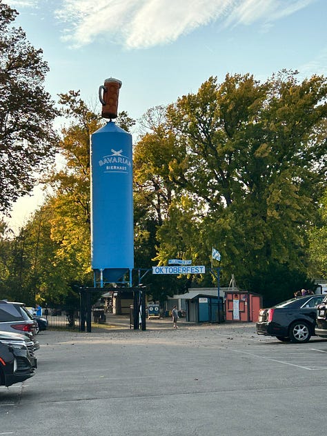 food, beer, stein, hall, tables, chairs, sign