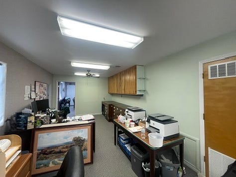 Six photos of the green walls in the office before we got to work painting..