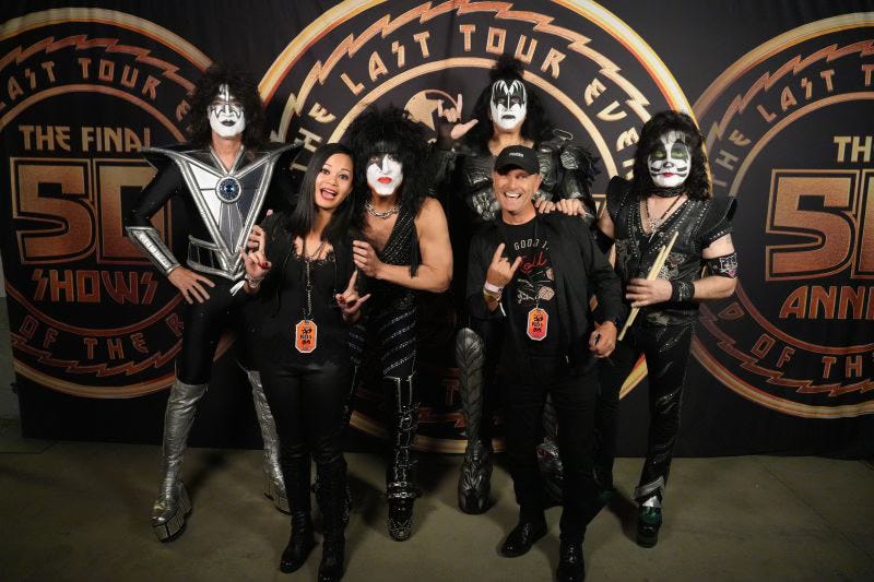 Johanna “Jojo” Atilano and Thierry Coup with the band KISS Johanna “Jojo” Atilano and Thierry Coup with the band KISS