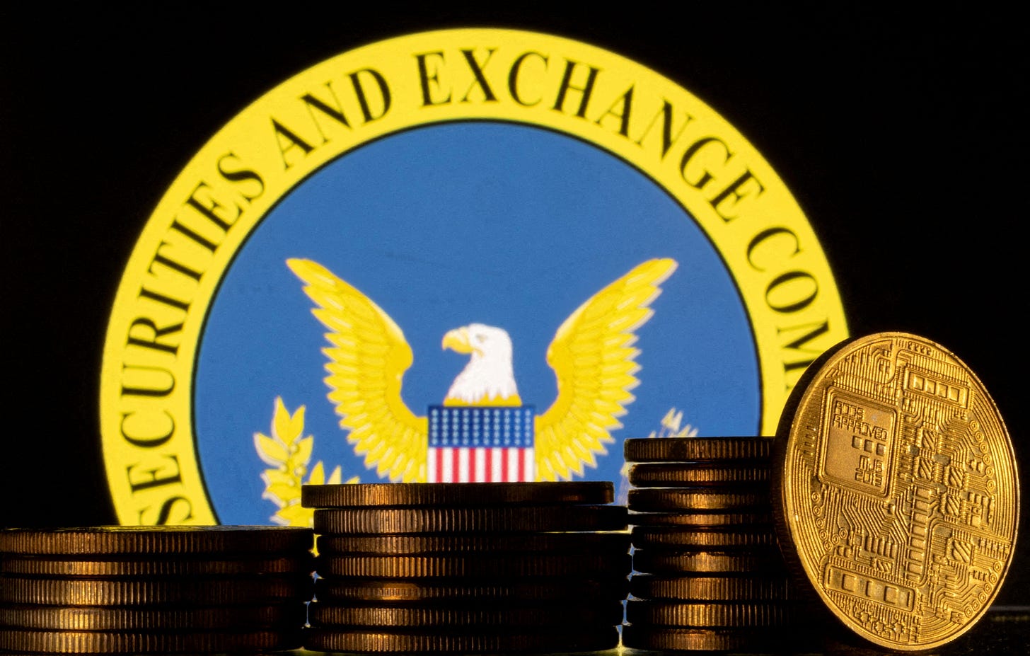 Illustration shows U.S. Securities and Exchange Commission logo and representations of cryptocurrency