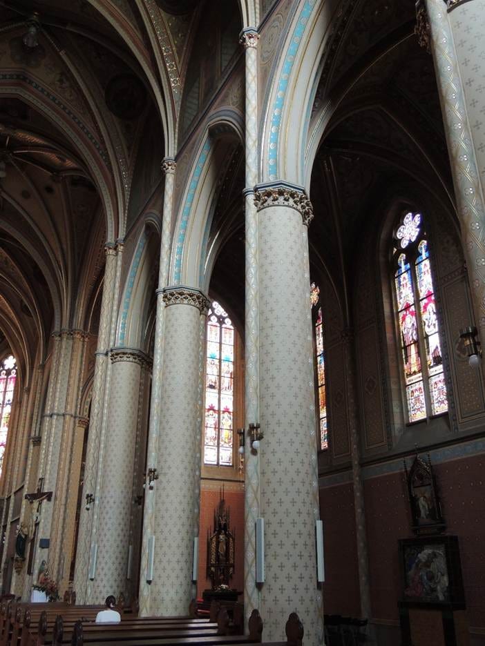 A large white column in a church

AI-generated content may be incorrect.