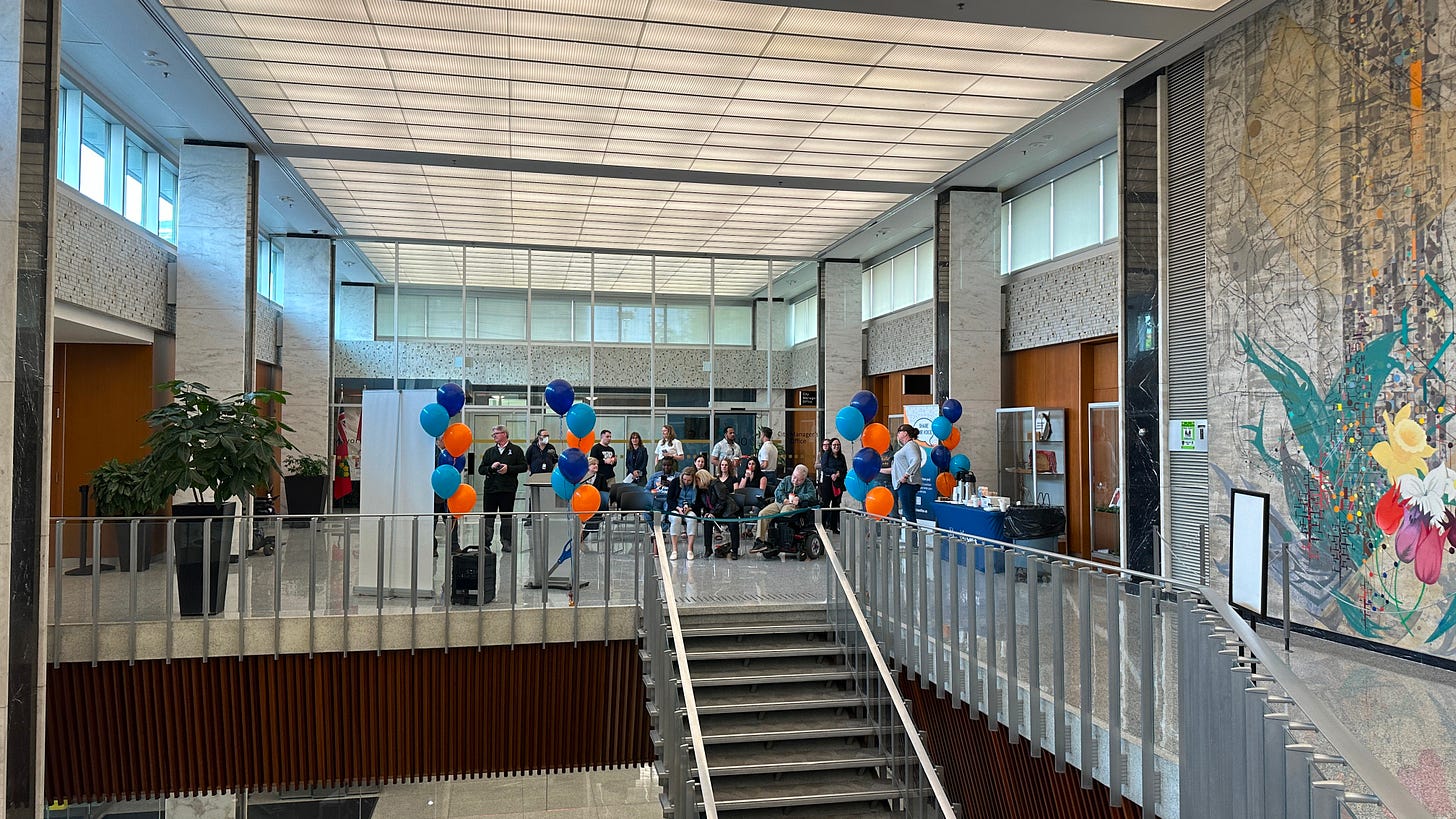 Celebrating the installation of tactile warning indicators for folks with disabilities on the stairs at City Hall on May 14, 2024