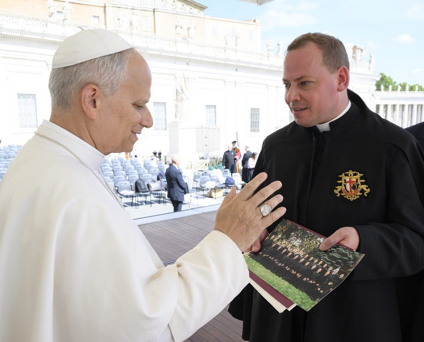 May be an image of 2 people and text