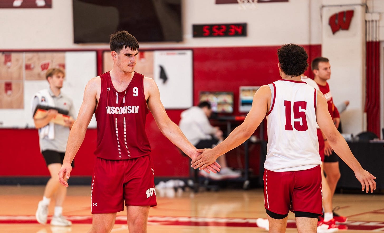 Wisconsin guards Jackson Ball and Owen Foxwell high-five during a Badgers basketball practice inside the Nicholas-Johnson Pavilion. Wisconsin guards Jackson Ball and Owen Foxwell high-five during a Badgers basketball practice inside the Nicholas-Johnson Pavilion.