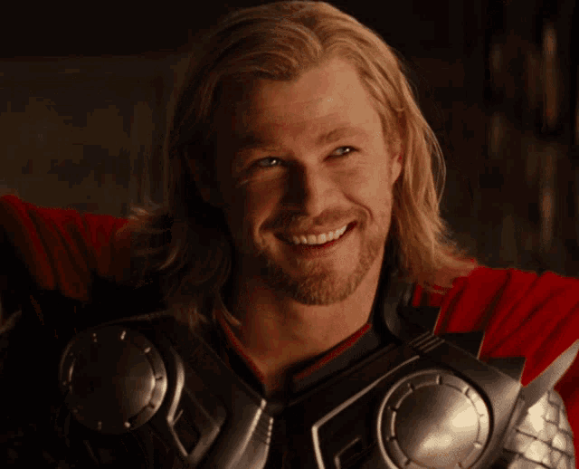 The Marvel character Thor, portrayed by Chris Hemsworth, winks as the camera pushes in on his face.