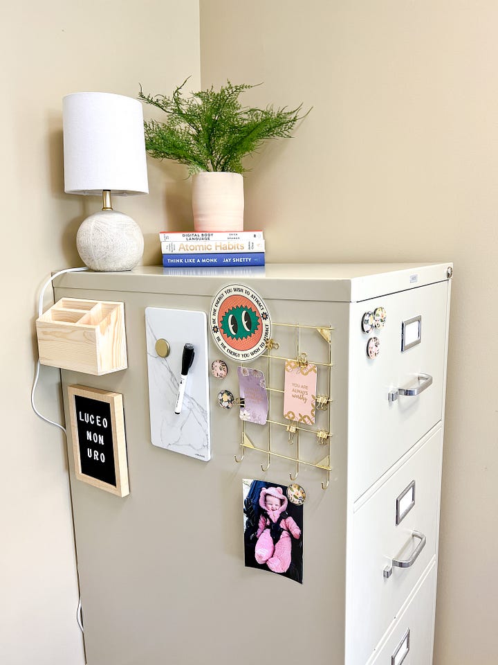 colorful office supplies on a desk with file cabinet