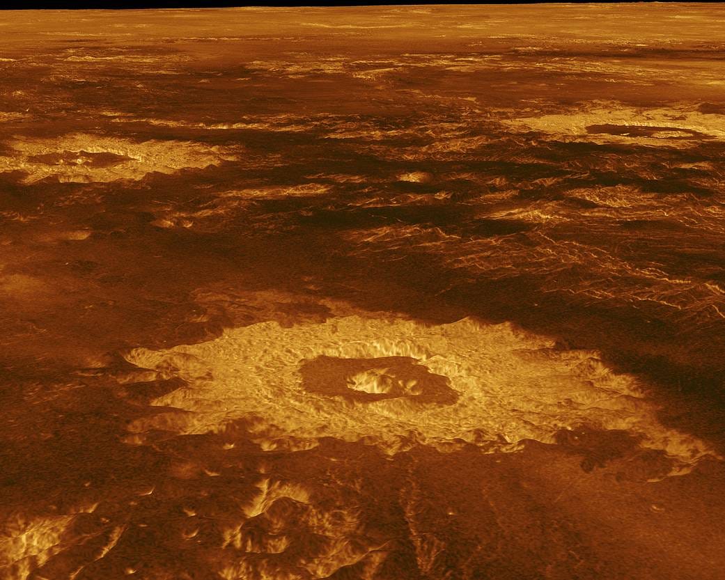 Three impact craters are displayed in this three-dimensional perspective view of Venus' surface. The center of the image is located at approximately 27 degrees south latitude, 339 degrees east longitude in the northwestern portion of Lavinia Planitia. Three impact craters are displayed in this three-dimensional perspective view of Venus' surface. The center of the image is located at approximately 27 degrees south latitude, 339 degrees east longitude in the northwestern portion of Lavinia Planitia.