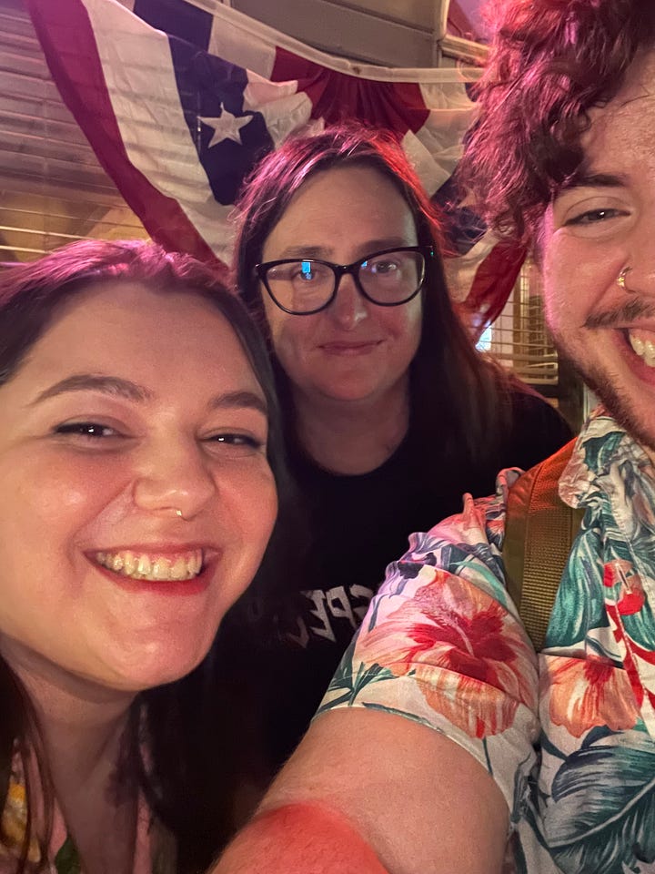 left: copy of NEVER BEEN SHIPPED; right: selfie of Sarah, me, and KT