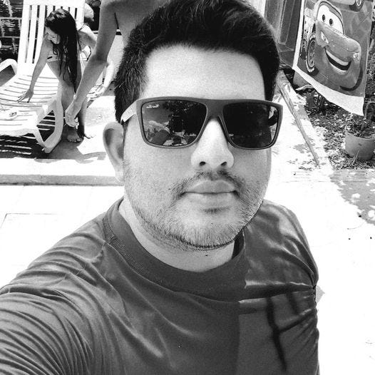 May be a black-and-white image of 1 person, beard and pool