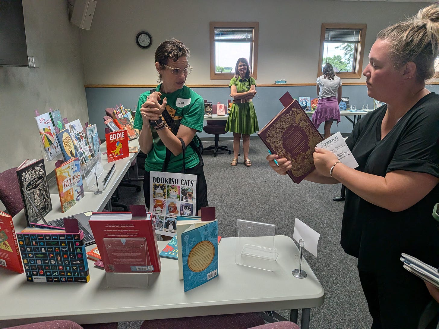 Image: A bookseller and a teacher preview what’s available together Image: A bookseller and a teacher preview what’s available together
