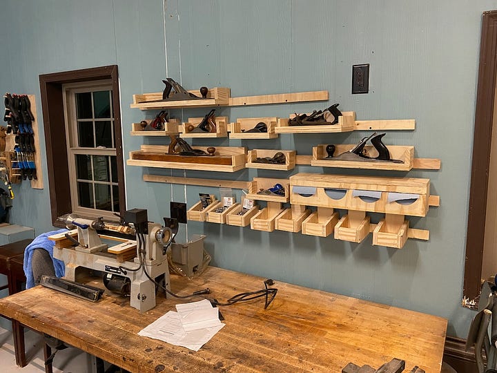 Wall-mounted French cleats to hold my planes and other things.