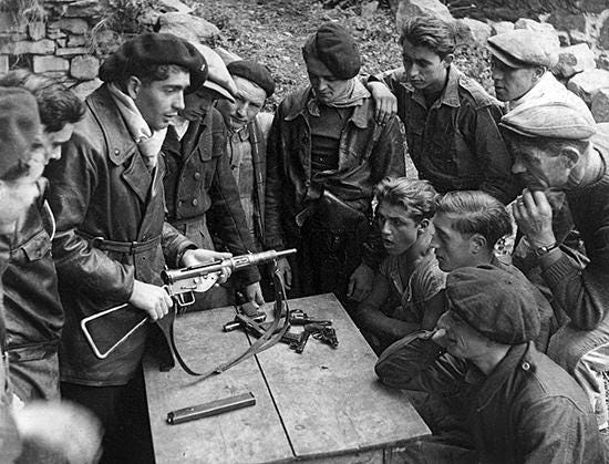 French Resistance members receive instructions on the operation of a  British Sten sub machine gun. Date and location unknown : r/wwiipics