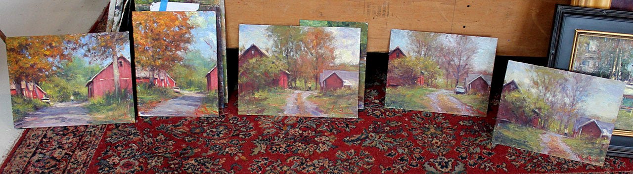 A group of paintings on a red carpet

Description automatically generated