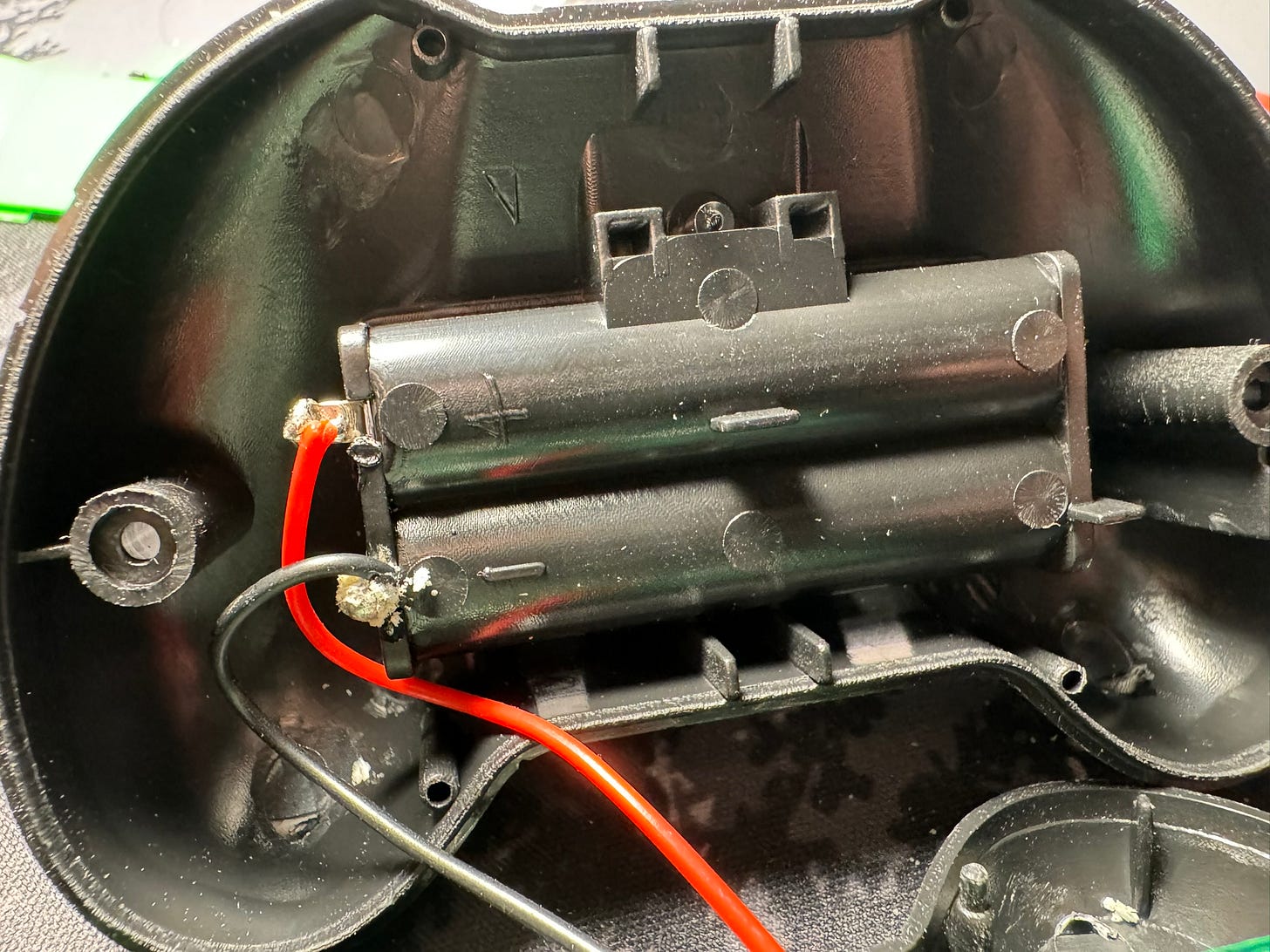 Battery power leads showing corrosion on solder joints