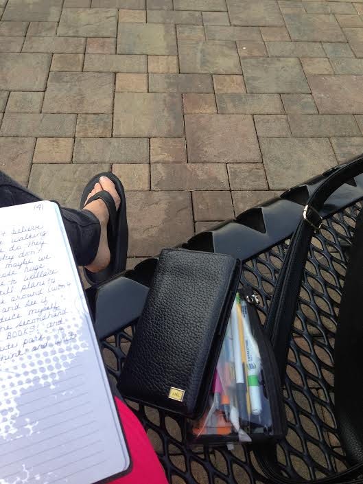 think and write on park bench