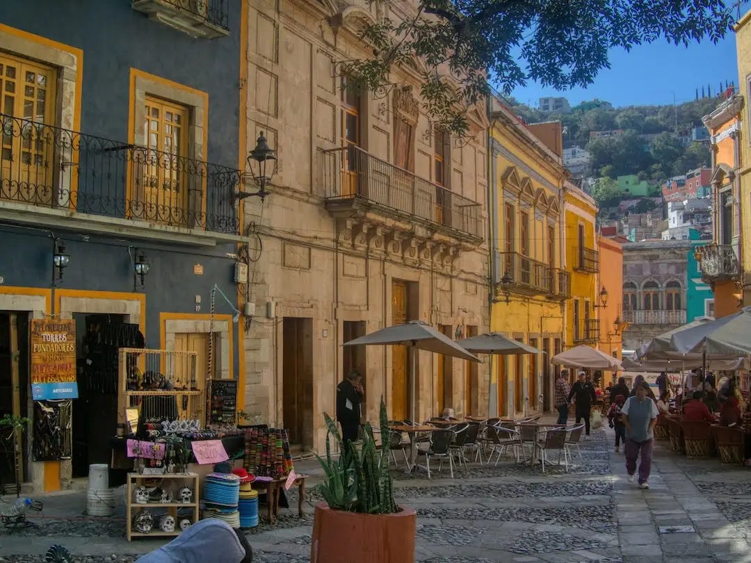 A row of restaurants with outside seating