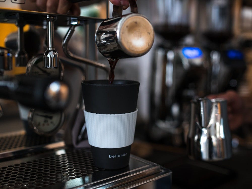 stainless steel and black coffee maker