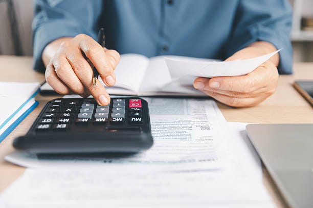 Close-up of a person using a calculator and holding receipts while filling out a US individual income tax return form at a desk. Concept for tax preparation, financial planning, and accounting. Close-up of a person using a calculator and holding receipts while filling out a US individual income tax return form at a desk. Concept for tax preparation, financial planning, and accounting. deductions stock pictures, royalty-free photos & images Close-up of a person using a calculator and holding receipts while filling out a US individual income tax return form at a desk. Concept for tax preparation, financial planning, and accounting. Close-up of a person using a calculator and holding receipts while filling out a US individual income tax return form at a desk. Concept for tax preparation, financial planning, and accounting. deductions stock pictures, royalty-free photos & images