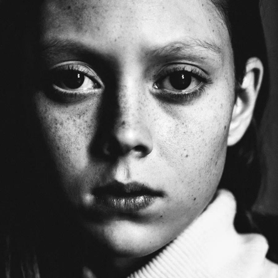 May be a black-and-white image of 1 person and child May be a black-and-white image of 1 person and child