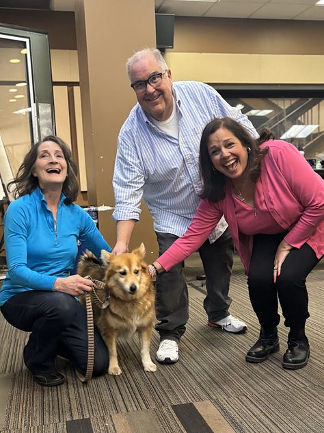 Woman and dog standing outside WCCO radio sign plus three adults and one dog inside WCCO radio studio