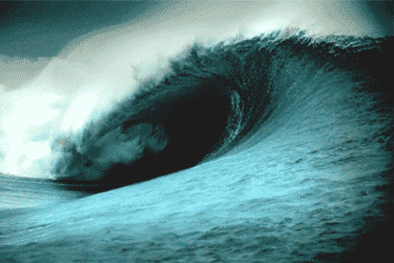 This may contain: a large wave is breaking in to the ocean with it's water swirling around
