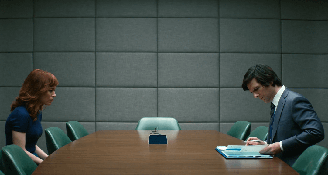 In S1E1, when Helly R. is confused about the Severance Floor, Mark S. flips  through the SOP booklet, and you can see a make-up gash on his forehead  shortly BEFORE Helly actually