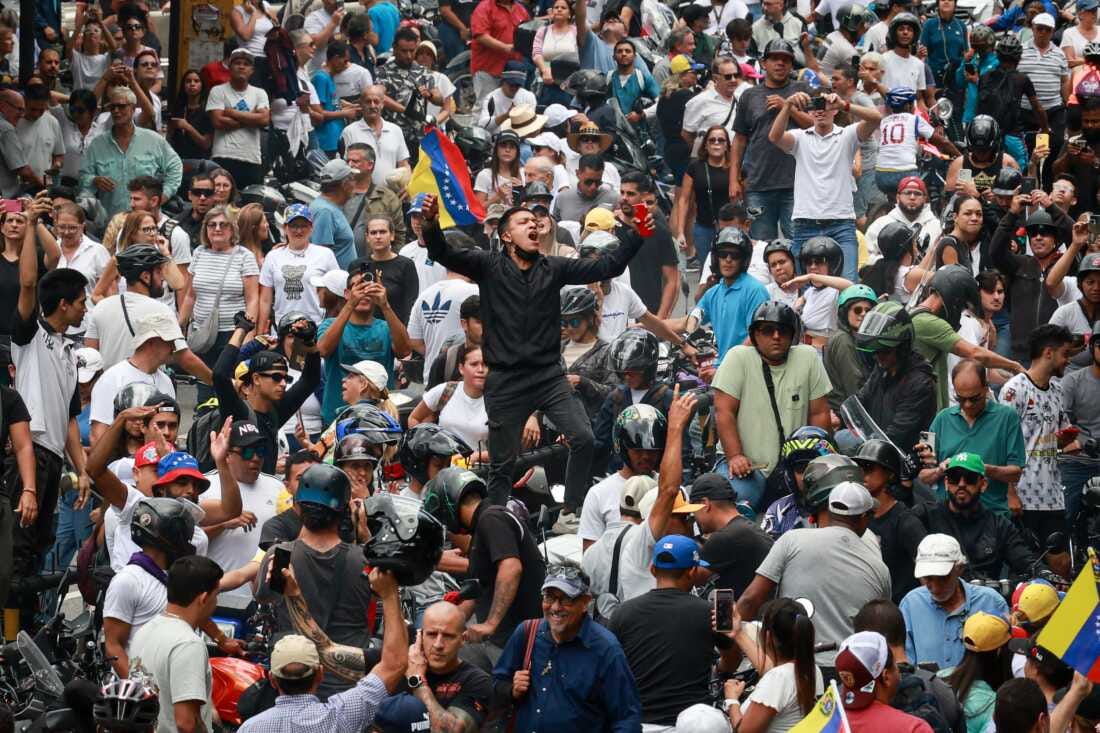 A supporter shouts slogans during a protest on Tuesday against the result of the presidential election in Caracas, Venezuela. President Nicolás Maduro was declared as the winner of the 2024 presidential election over his rival, Edmundo González. The result has been questioned by the opposition and internationally.