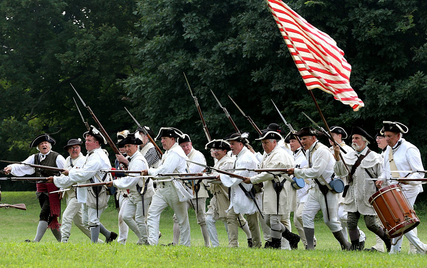 soldiers with rifles and bayonets marching