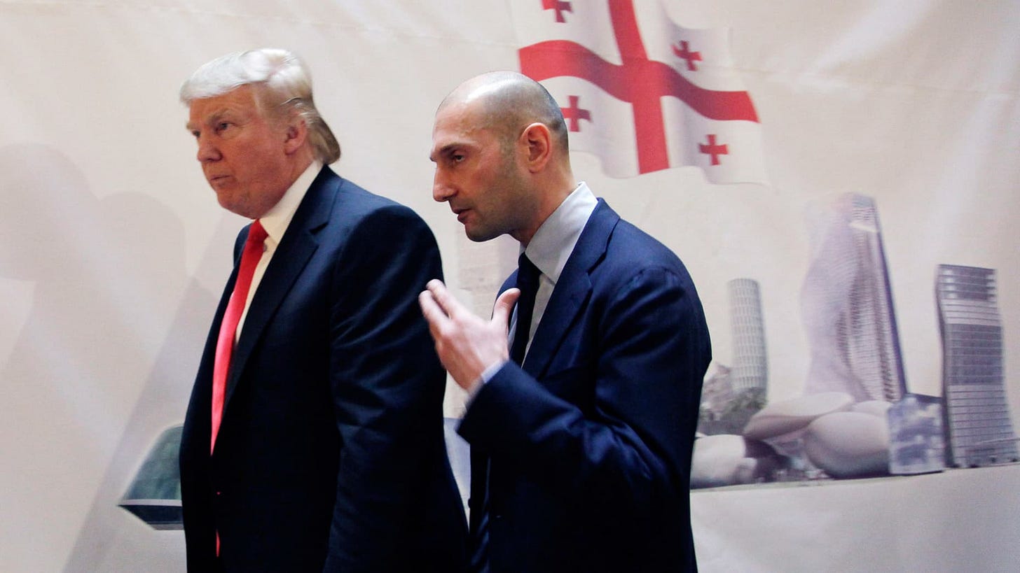 Real estate developer Donald Trump, left, and George Ramishvili, Chairman of Silk Road Group, talk following a news conference in New York, Thursday, March 10, 2011.